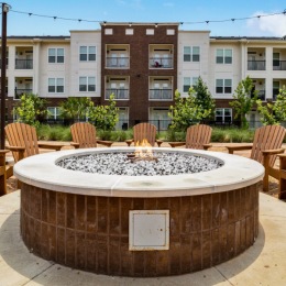 a fire pit near a building