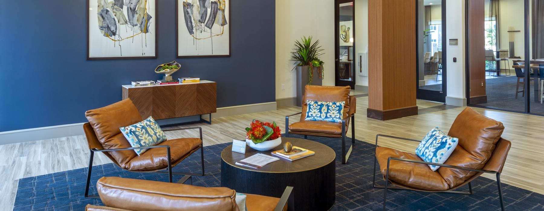 a room with chairs and a coffee table