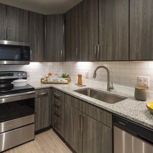a kitchen with black appliances